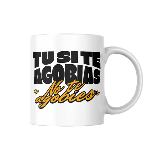 Taza de cerámica blanca con la frase "Si te agobias, no te agobies" en tipografía grande negra con detalles en amarillo, diseño humorístico de la marca valenciana Canya de Sucre. 